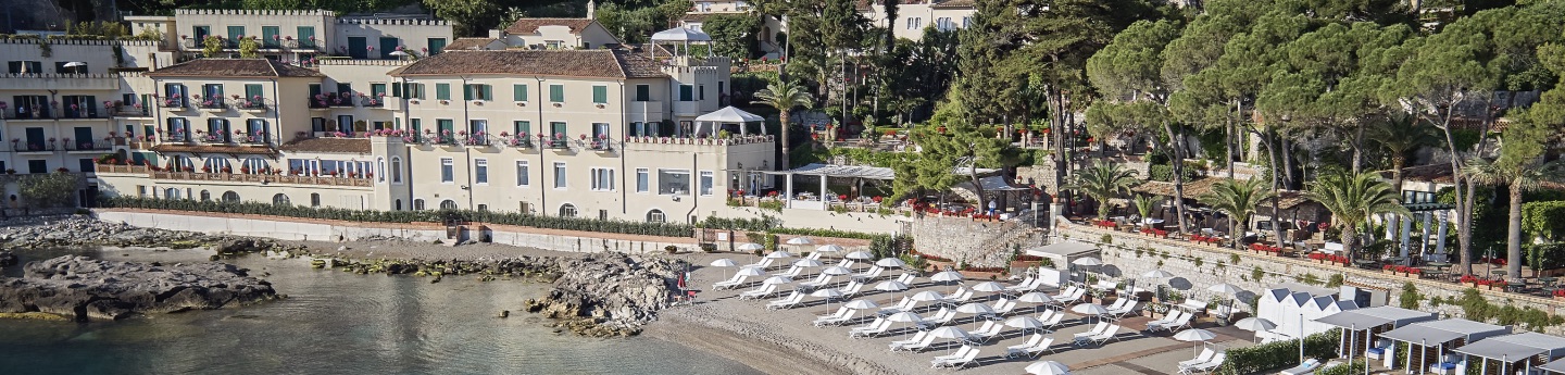 The hotel and its private beach in Taormina