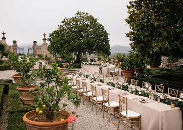 Wedding dinner alfresco in the Italian Garden in Tuscany